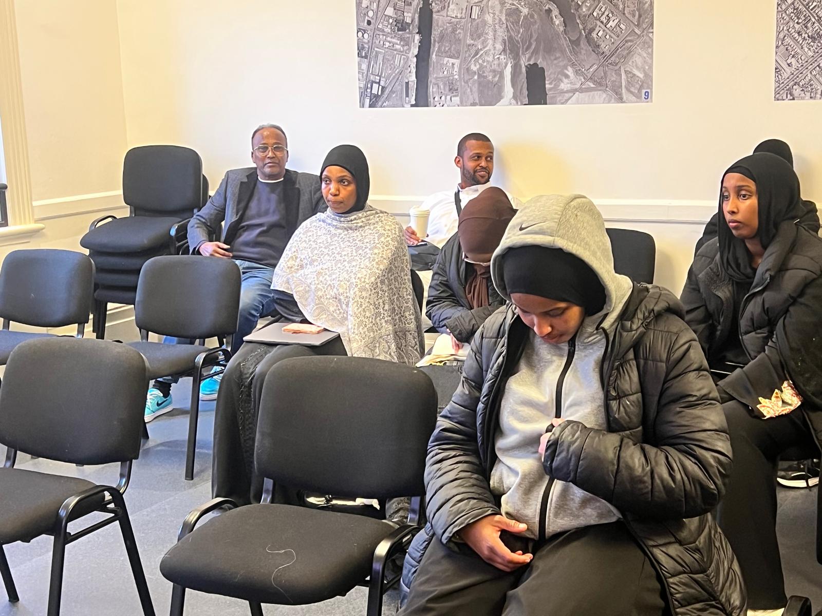 Workshop participants listening to a speaker